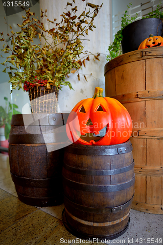 Image of Pumpkins on old barrel
