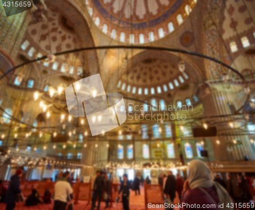 Image of blur image of Muslims praying inside Mosque