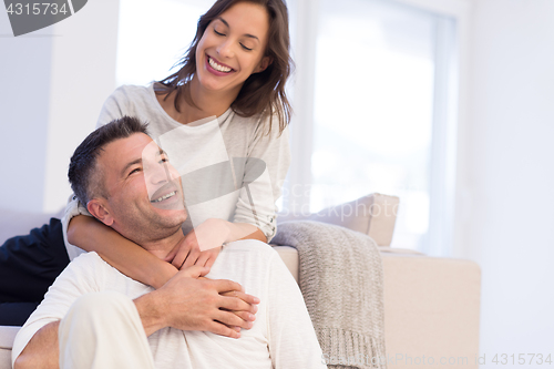 Image of couple hugging in their new home