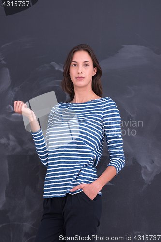 Image of woman standing in front of chalk drawing board