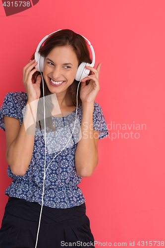 Image of woman with headphones isolated on a red