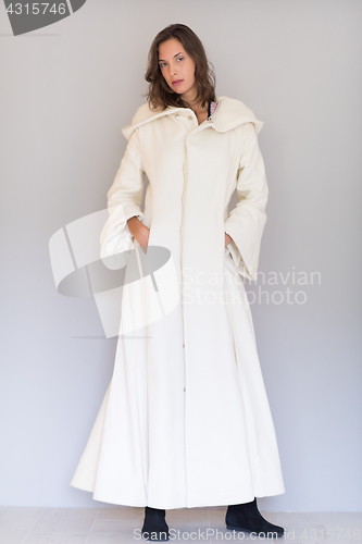 Image of woman in a white coat with hood isolated on white background