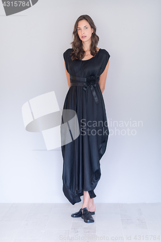 Image of woman in a black dress isolated on white background