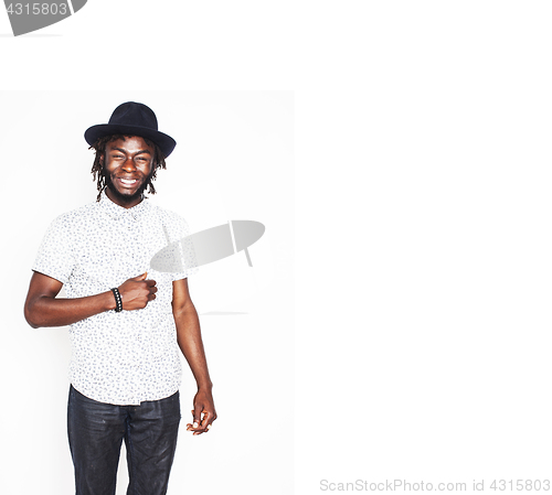 Image of young handsome afro american boy in stylish hipster hat gesturin