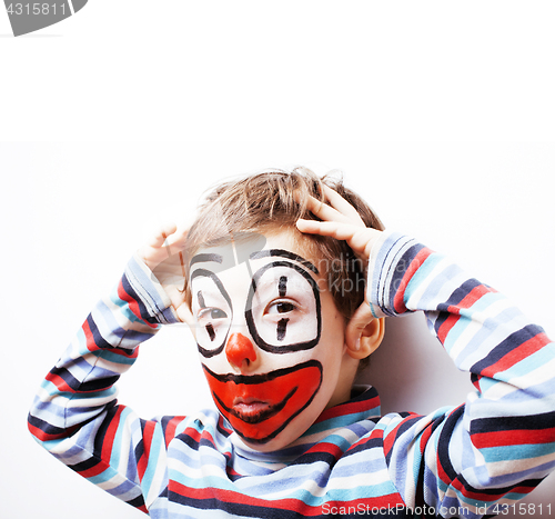 Image of little cute boy with facepaint like clown, pantomimic expression