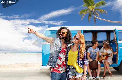 Image of happy hippie couples and minivan on beach