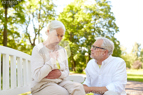 Image of senior woman feeling sick at summer park