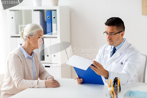 Image of senior woman and doctor meeting at hospital