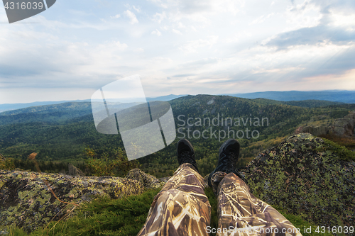 Image of Man resting in the mountains