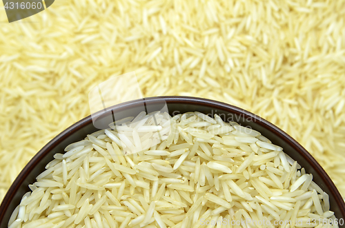 Image of White basmati rice with wooden bowl
