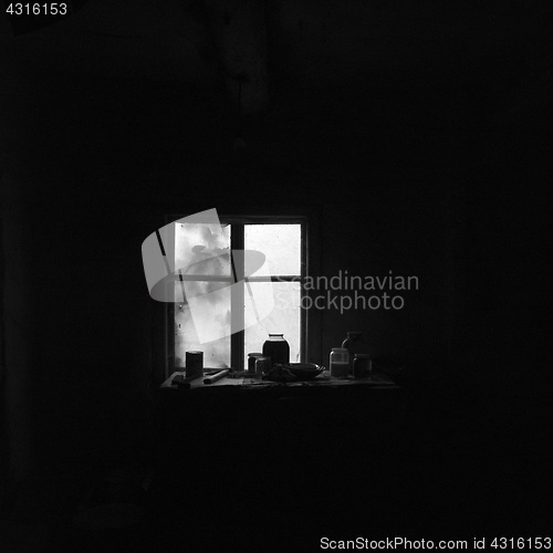 Image of Dishes on the wooden table in abandoned house.