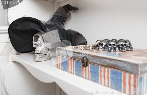 Image of Human skull in a white cabinet. Halloween theme