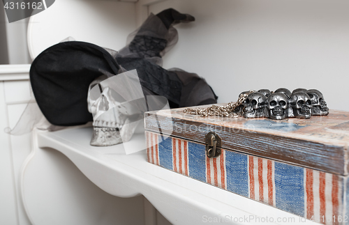 Image of Human skull in a white cabinet. Halloween theme