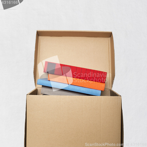 Image of cardboard box full of books