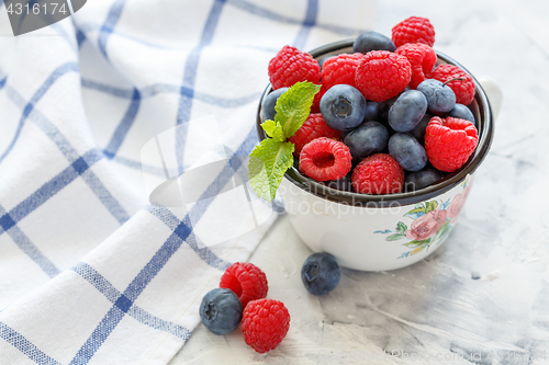 Image of Mug with blueberries and raspberries.