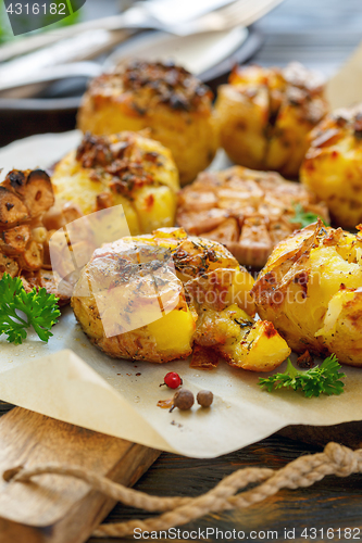 Image of Potatoes baked in their skins with spices.