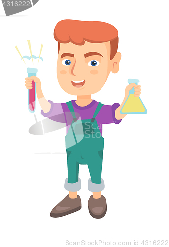 Image of Little caucasian boy holding test tube and beaker.