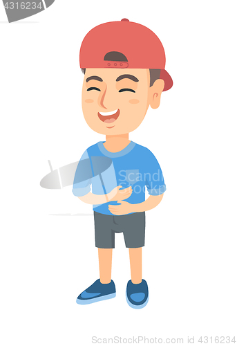 Image of Caucasian cheerful boy in a cap laughing.