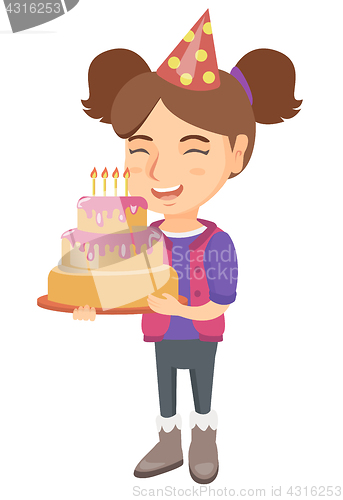 Image of Caucasian child holding birthday cake with candles