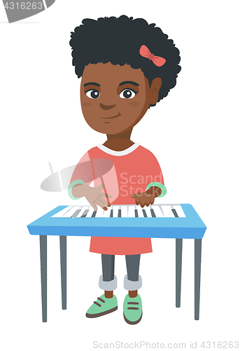 Image of Little african-american girl playing the piano.
