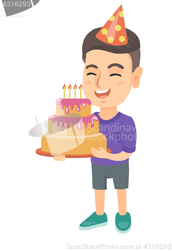 Image of Caucasian child holding birthday cake with candles