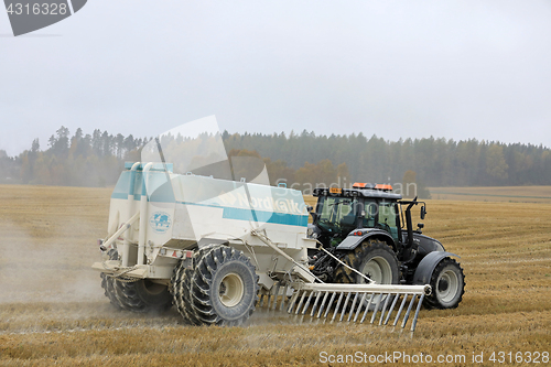 Image of Spreading Agricultural Lime on Stubble Field in Autumn