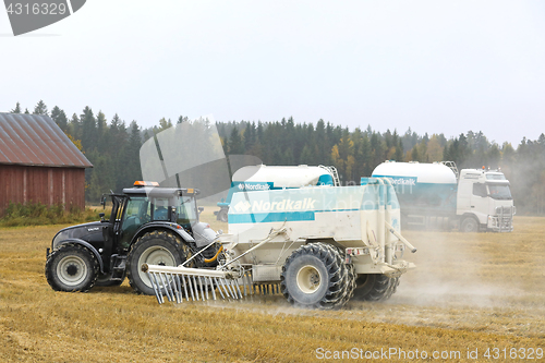 Image of Transporting and Spraying Agrilime on Field