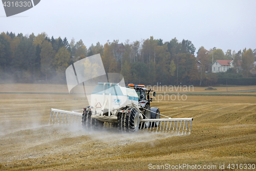 Image of Spreading Agrilime on Field in Autumn 
