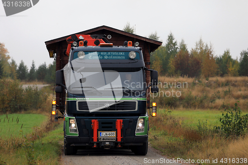 Image of Volvo FM Truck Transports Wooden Cabin 