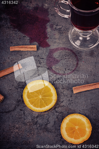 Image of Spilled mulled wine and orange, retro toned