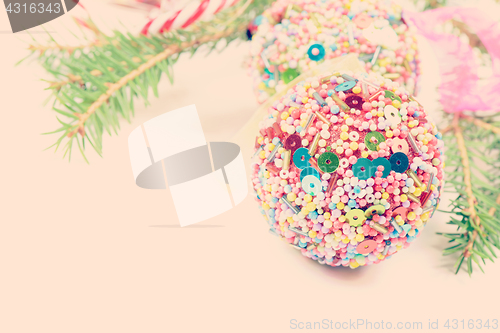 Image of Christmas balls with green spruce, retro toned