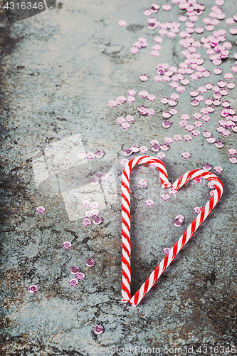 Image of Christmas decorations - candy canes and sequins, retro toned