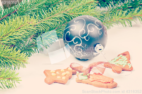 Image of Gingerbread cookies with christmas tree and ball, retro toned