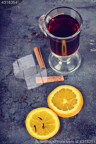 Image of Red mulled wine and different spices, retro toned