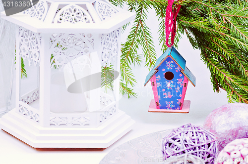 Image of Christmas toy birdhouses and other decorations, retro toned