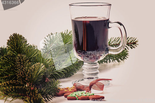 Image of Red mulled wine and different decorations, retro toned