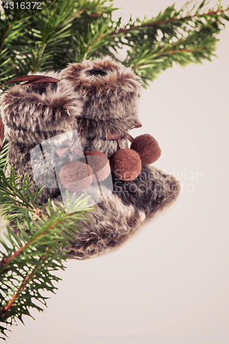 Image of Winter boots with christmas tree, retro toned