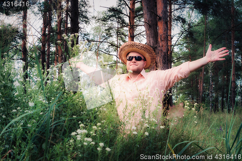 Image of Man Raised Arms on the Forest Lawn