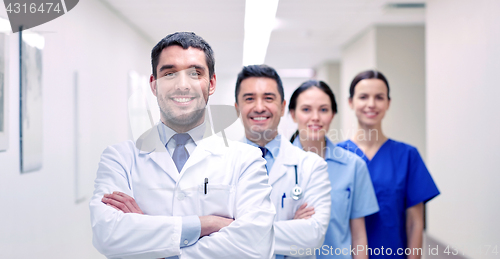 Image of group of happy medics or doctors at hospital