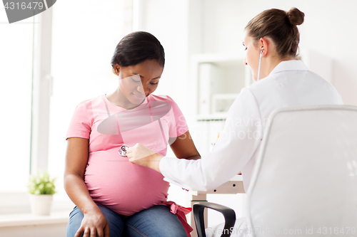 Image of gynecologist doctor and pregnant woman at hospital