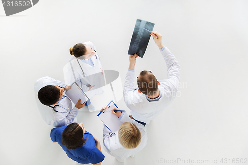 Image of doctors with spine x-ray and clipboards