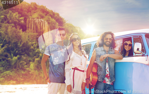 Image of happy hippie friends at minivan car on island