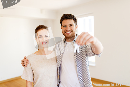 Image of happy couple with keys of new home