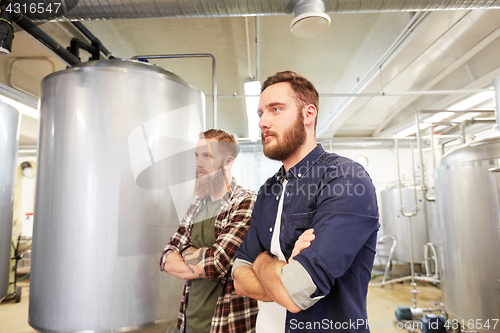 Image of men at craft brewery or beer plant