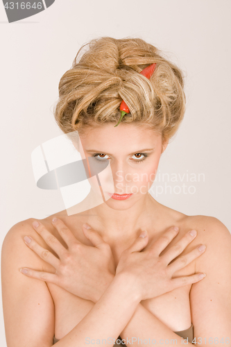 Image of Portrait of a woman with vegetables in your hair