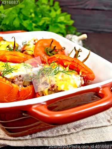 Image of Tomatoes stuffed with rice and meat in brazier