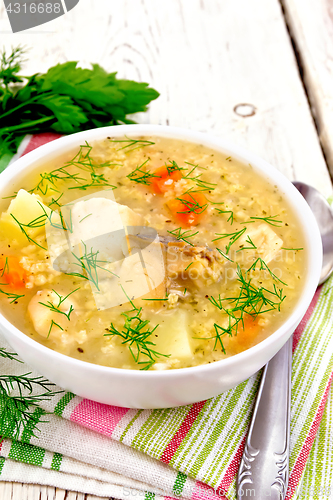 Image of Soup fish with millet on board