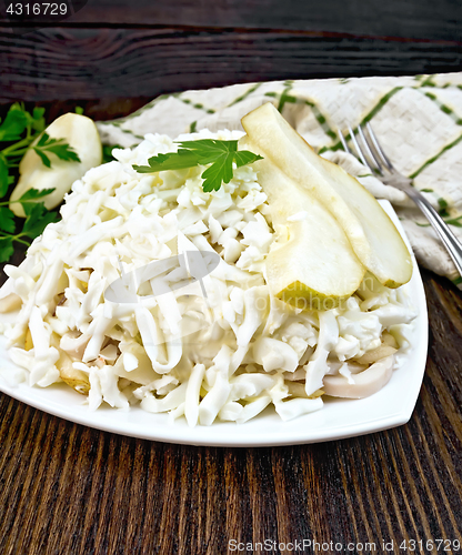 Image of Salad of squid and pears on board