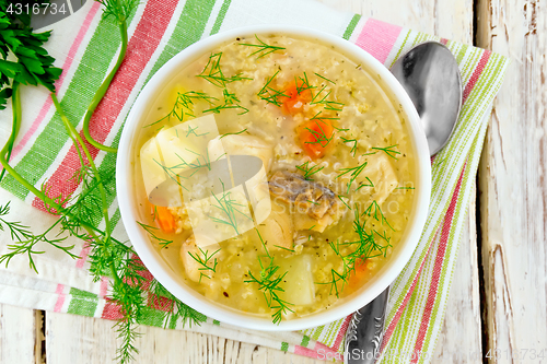 Image of Soup fish with millet on board top