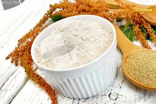 Image of Flour amaranth in bowl with spoon on board